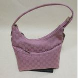 A Gucci pink canvas shoulder bag, 23cm wide