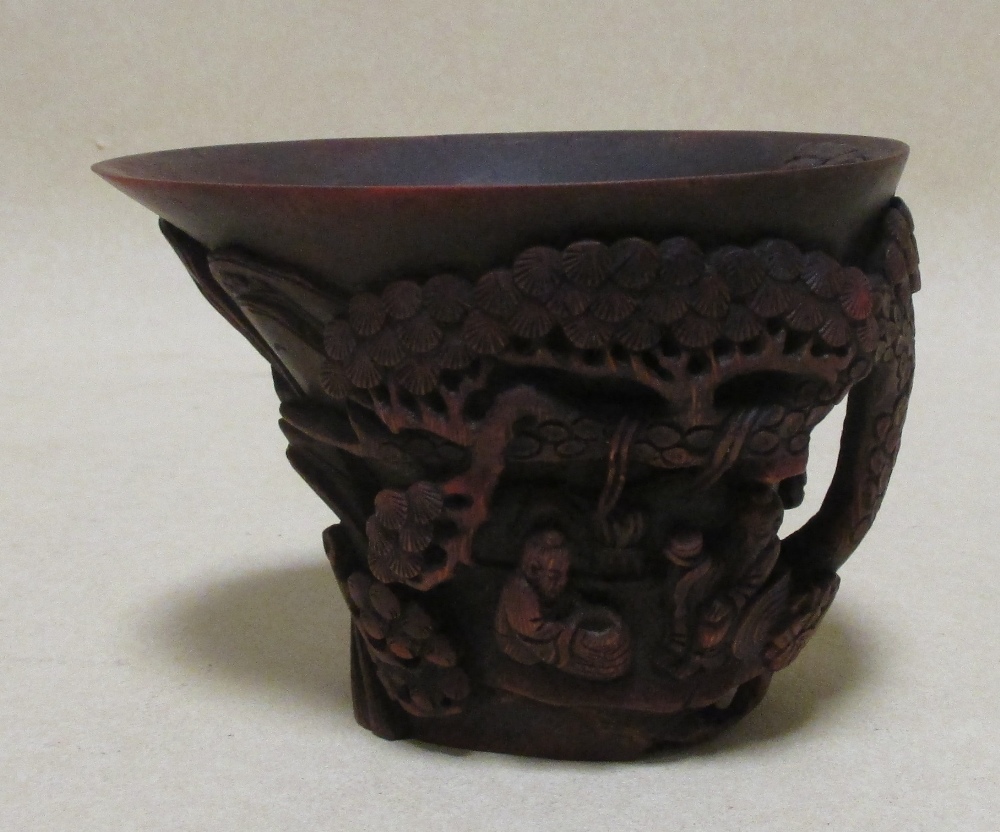 A Chinese carved bamboo libation cup together with a stone pig