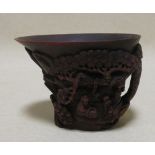 A Chinese carved bamboo libation cup together with a stone pig