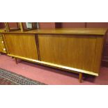 A teak sideboard, 80 x 214 x 52cm, together with a nest of tables