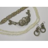 A miniature mother of pearl case timepiece, silver filigree jewellery and three strand pearl