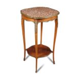 A Transitional style mahogany and rouge marble gueridon, the shaped top with gilt brass mounts