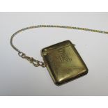 A 9ct gold vesta case, Birmingham 1923, on later bi-coloured chain set with a lobster claw clasp