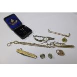 A 15ct gold cased penknife, a yellow metal riding crop brooch, a pair of mother of pearl and green