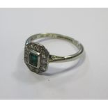 An emerald and diamond ring, the white precious metal stamped 18ct platinum