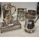 A silver tankard, London 1889, together with another silver tankard, two other silver plated
