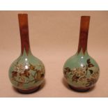 A pair of Royal Doulton faience bottle vases, 20cm high