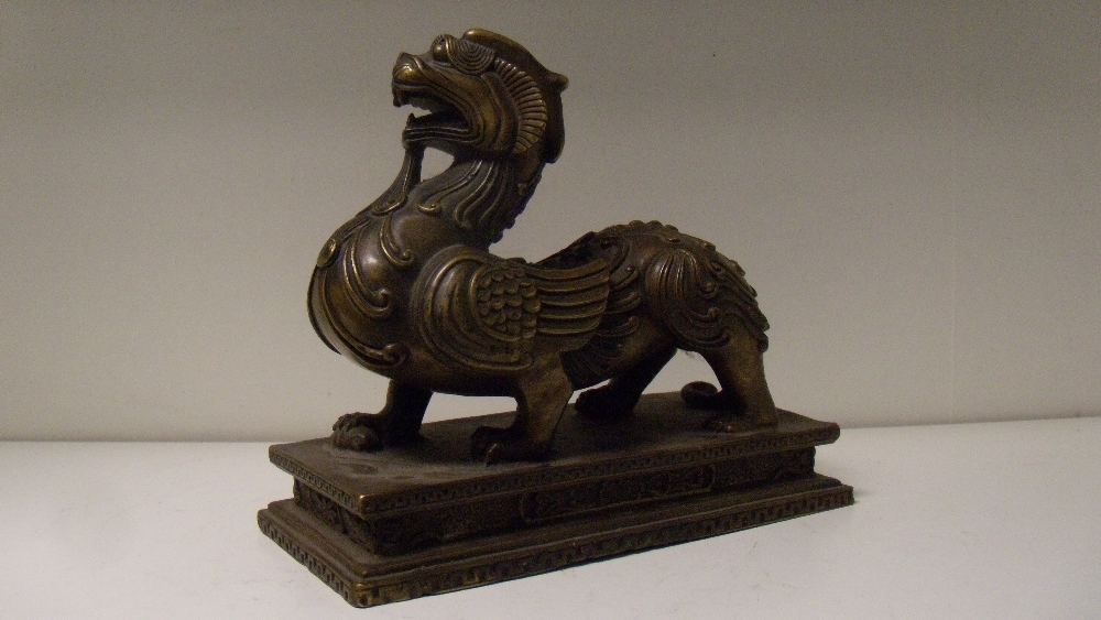 A 20th century Chinese bronze figure of a bixie, 19.5cm (7.75 in) wide  This appears to have been