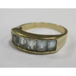 A 9ct gold pale blue hardstone channel set ring, size N/O