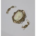 A pale pink shell cameo brooch in bright cut engraved yellow metal mount, together with a pair of