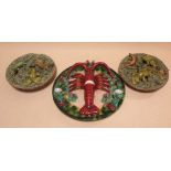 A pair of Pallissy style pottery wall plates modelled with lizards, toad and crocodile together with