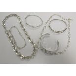 A group of silver jewellery to include two necklaces, three bangles and a bracelet