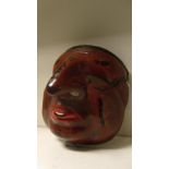A Japanese lacquer mask, 21cm (8.25 in) high  This has restoration to a line from the eyes below the
