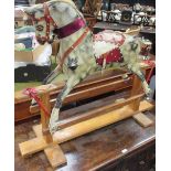 An early 20th century carved wooden rocking horse