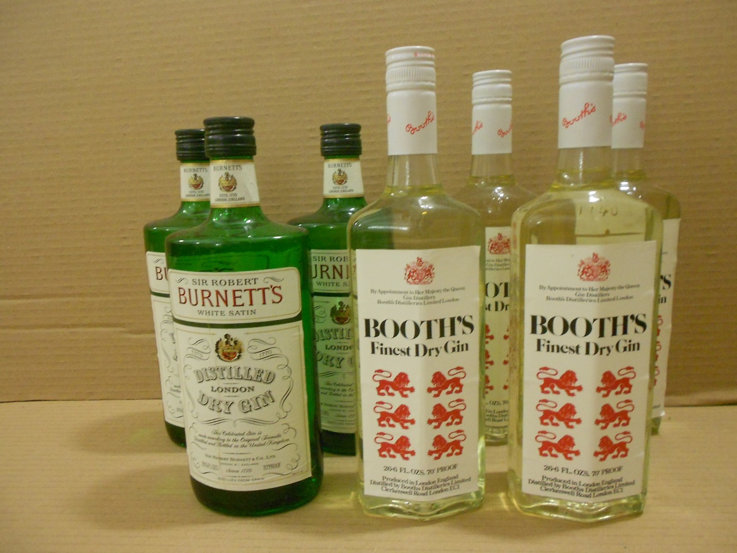 Sir Robert Burnett's White Satin Gin, three 26 2/3fl.ozs bottles, 70% proof; Booth's Finest Dry Gin,
