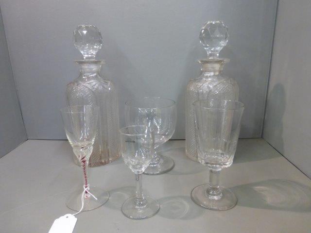 A pair of late Georgian cut glass decanters and four 19th Century and later drinking glasses.