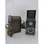 Yesterday's World Camera Shop - a cased Meopta Flexaret camera.