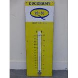 A Duckham's 20-50 Motor Oil enamel thermometer, in very good condition, 13 x 36".