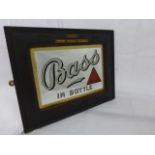 A small Bass in bottle advertising mirror in original frame, stamped and with applied crest, plume