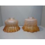 Two Edwardian amber tinted flared glass lamp shades.