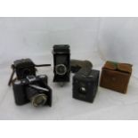 A Zeiss Ikon Klio camera, a leather cased Zeiss Ikon Telma Nettor-Anastigmat camera, a