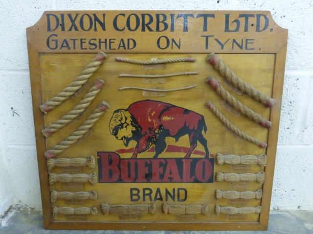 An unusual Buffalo Brand wooden advertising sign with 19 samples of rope and twist attached,