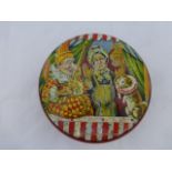 An early circular toffee tin with Punch and Judy to the lid.