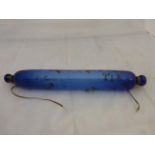 A Victorian blue glass rolling pin with all over decoration.