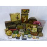 A large quantity of assorted tins.