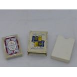 A Carburine Motor Spirit & Glico - Newton Motor Oils sealed pack of playing cards.