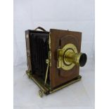 An early mahogany and brass mounted plate camera on tripod bearing an ivorine plaque - J.R. Grotz