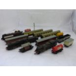 A small box of Hornby Dublo tinplate model railway items including three locomotives, five carriages