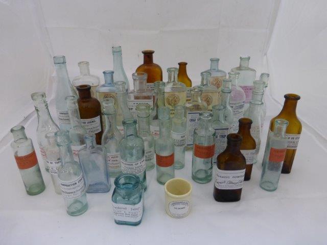 Forty small labelled chemist's bottles.