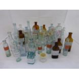 Forty small labelled chemist's bottles.