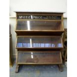 A McVitie & Price mahogany and marble topped three section display cabinet with rising glazed lids