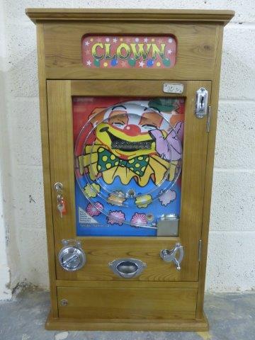 A reproduction 'Clown' Allwin style slot machine.