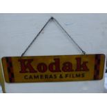 A Kodak Cameras & Films rectangular perspex hanging advertising sign, 18 1/4 x 5 1/4".