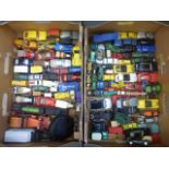 Two boxes of assorted play worn die-cast cars including early Dinky and Corgi.