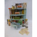 A four-tier semi-circular wooden toy display with a selection of early miniature packets advertising