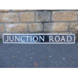 A rectangular street sign for 'Junction Road', 47 1/2 x 6".