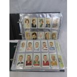 Two albums of assorted cigarette collectors cards, including Churchman's and Carreras depicting