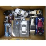 A box of assorted model cars 1/24 scale, including Burago and battery operated cars.