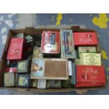 A large box of assorted tobacco related tins and packaging.