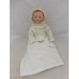 An Armand Marseille bisque headed doll, marked A.M. Germany, 341/8, 20 1/2" tall.