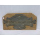 A cast metal 1907 Aberdare and Aberaman Consumers Gas Coy. sign mounted on an oak plaque, 17 1/2 x 8