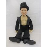An early ventriloquist's dummy with composite head, dressed in formal evening wear, 19 1/2 " tall.