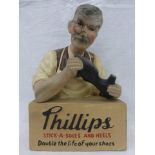 A Phillips Stick-a-Soles and Heels composite shop window display advertising figure.