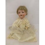A Simon & Halbig bisque headed doll dressed in silk and lace Christening clothes, stamped 126, 15"