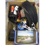 A box of 1970s Scalextric track and accessories and an assortment of postcards, mostly pictoral.