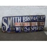 A Smith Bros & Co Ltd West Gate Bdgs, Bath, for Wines and Spirits rectangular enamel sign.